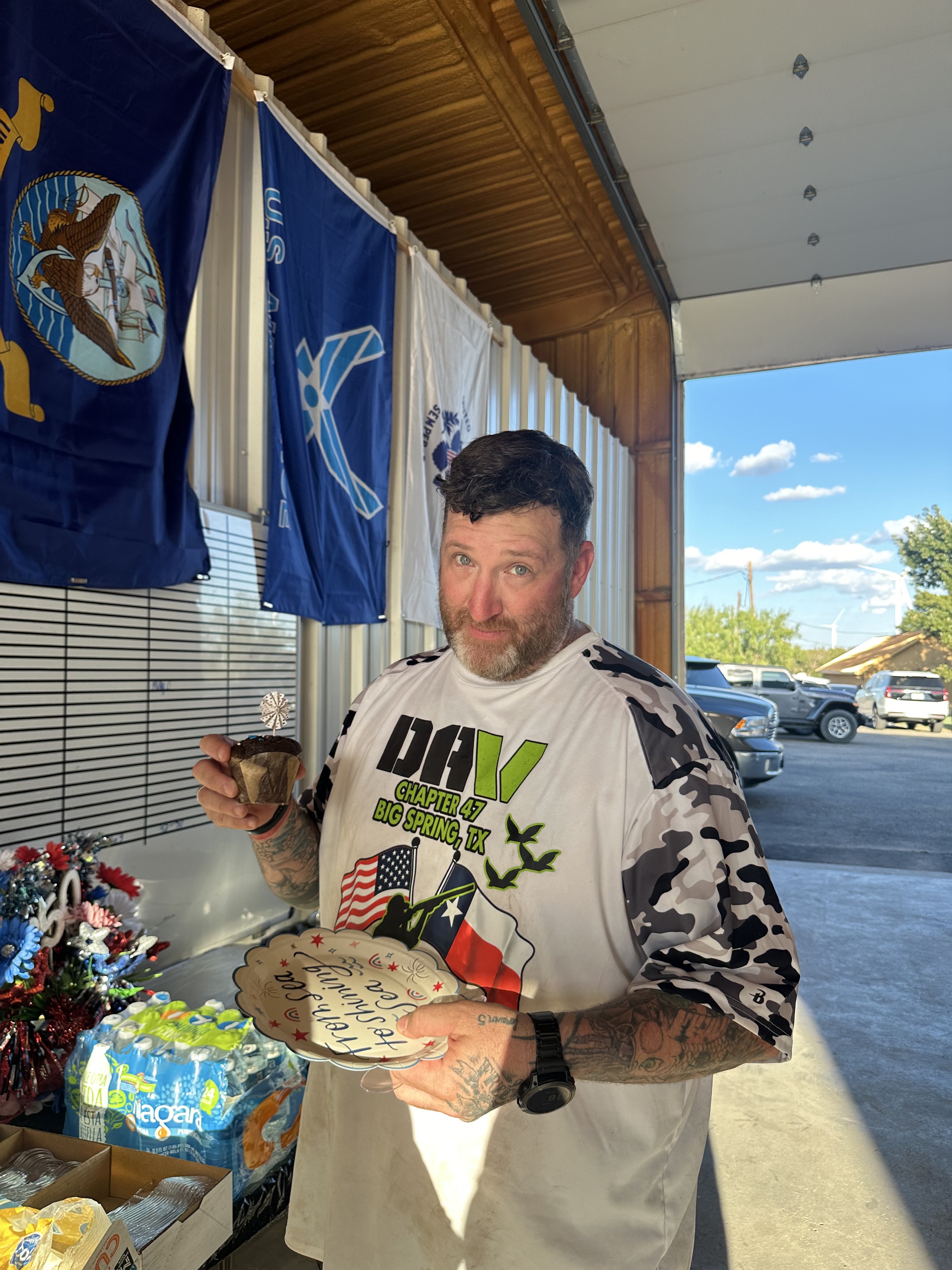 A DAV Chapter 47 participant celebrating with a cupcake and commemorative plate