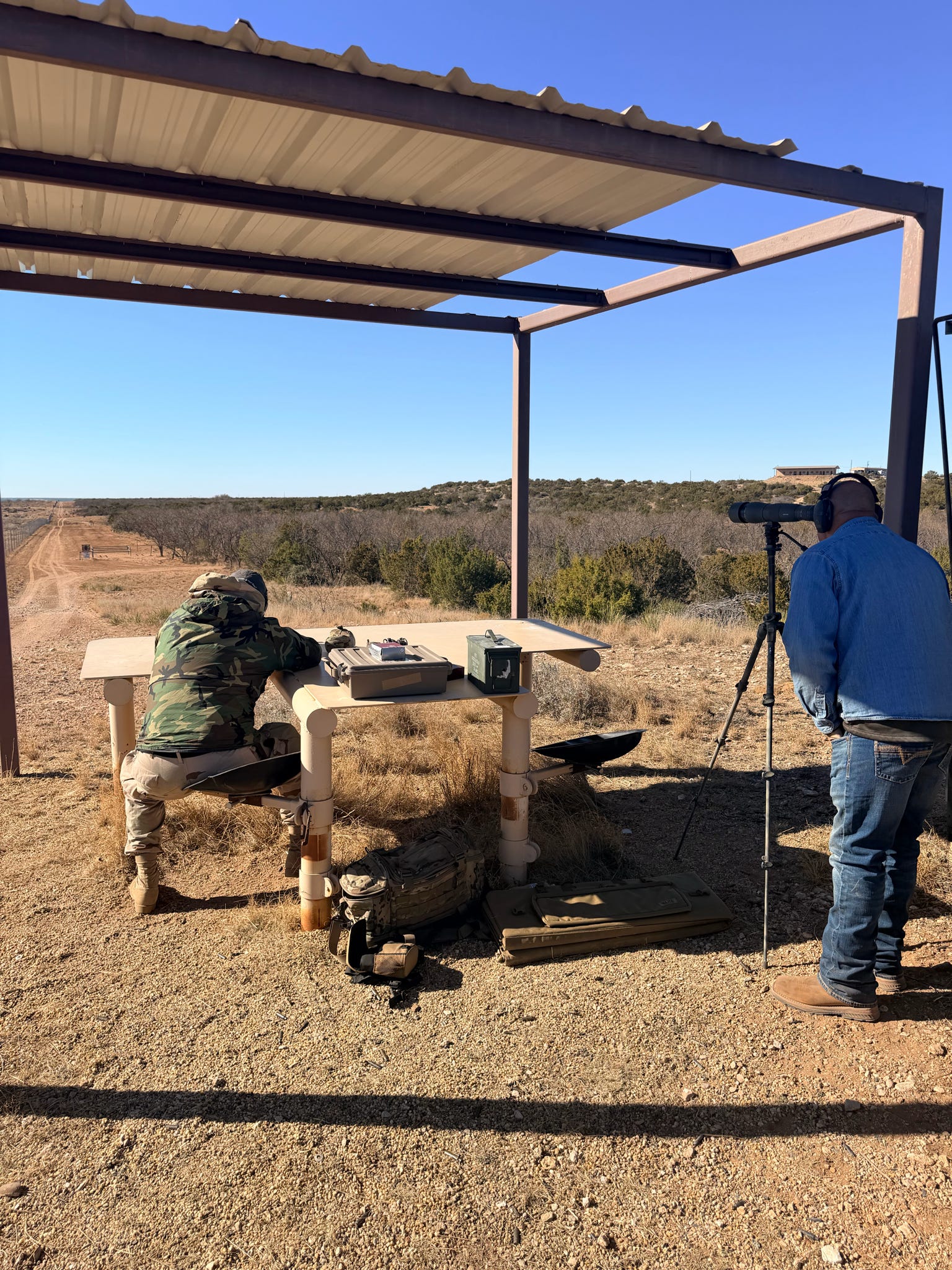 A shooter and spotter working together downrange