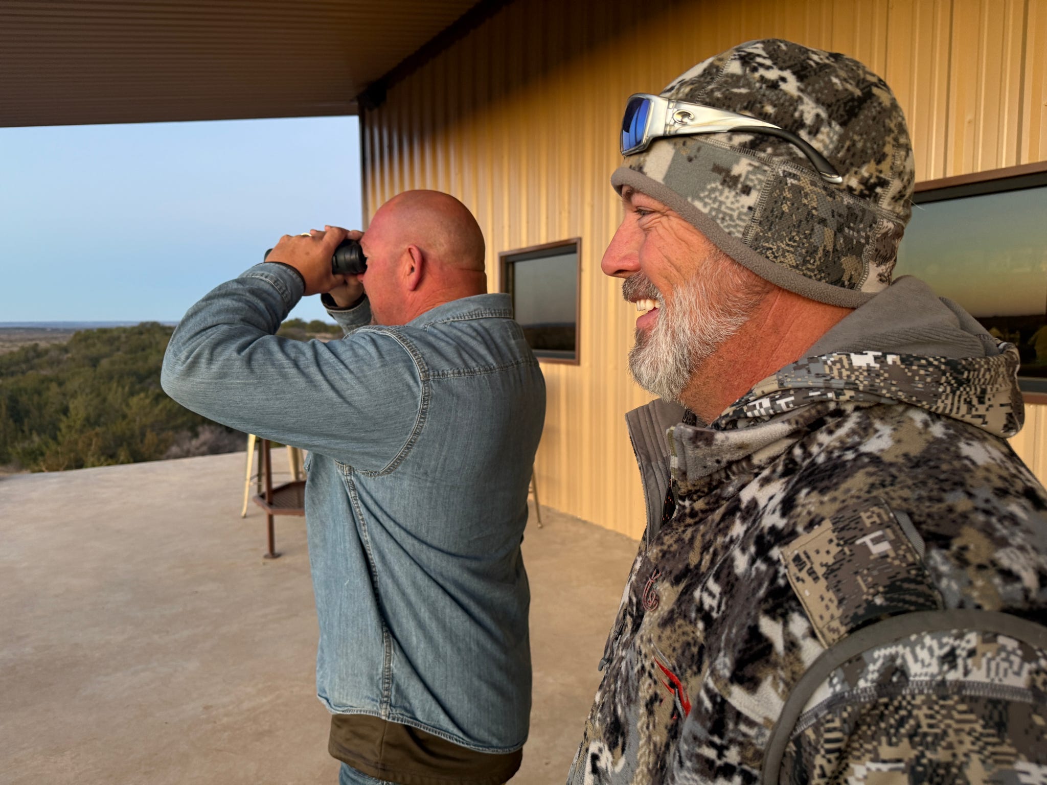 Two veterans spotting across open country